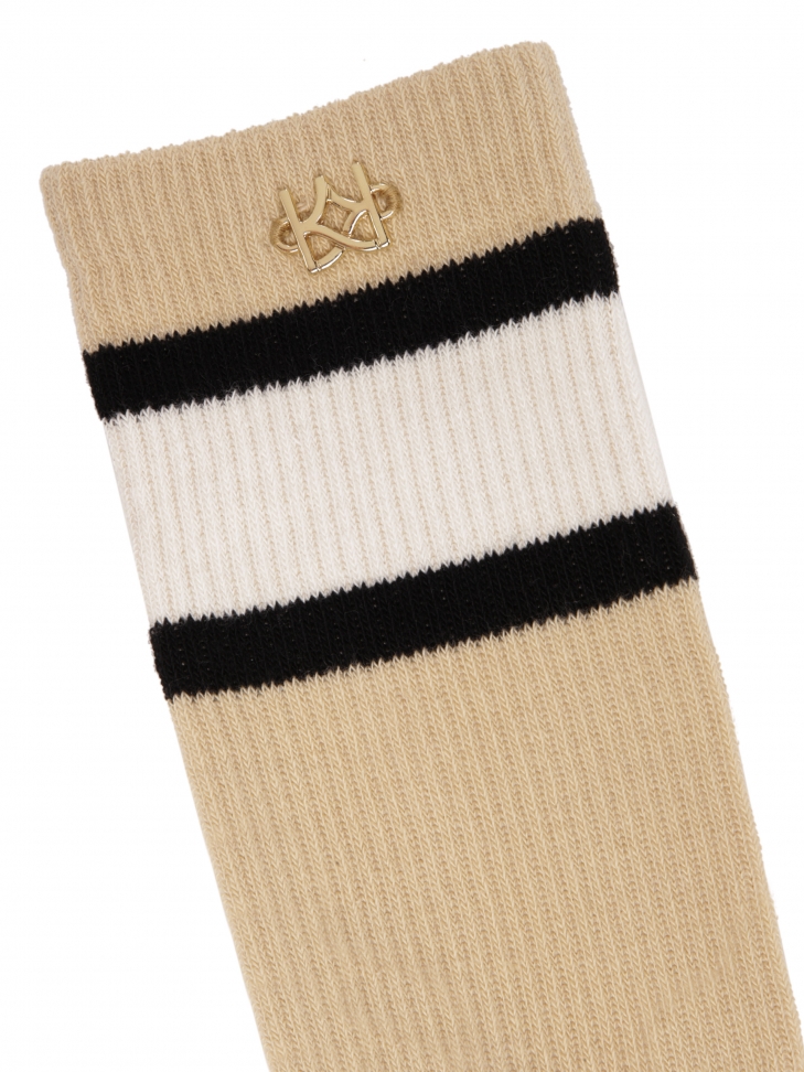 Calcetines de algodón beige decorados con un monograma dorado TANEY