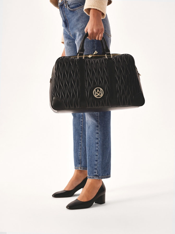 Bolsa de viaje de suave piel acolchada negra TRIP